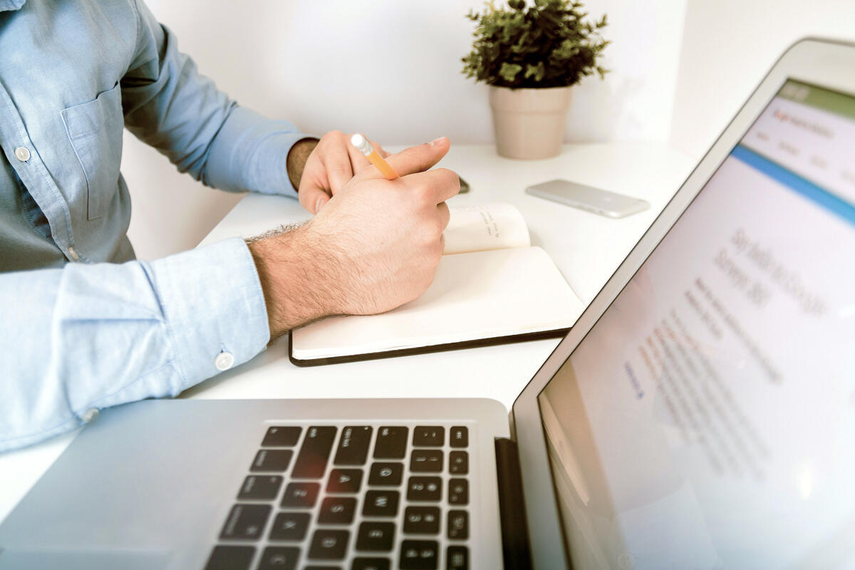 male accountant at keyboard